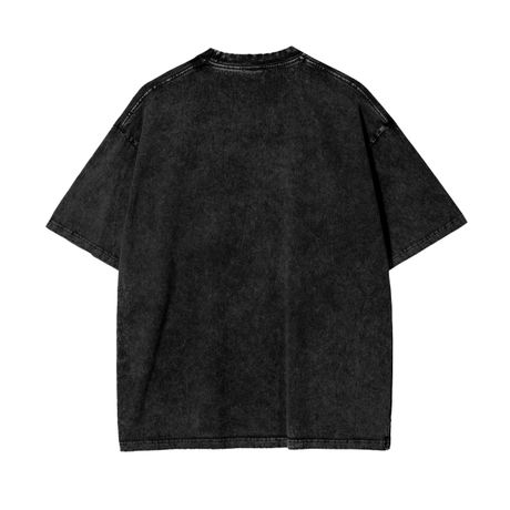 Black Zenitsu acid wash oversized T-shirt by ODMPOD, featuring a relaxed fit and distressed style, displayed on a flat surface.