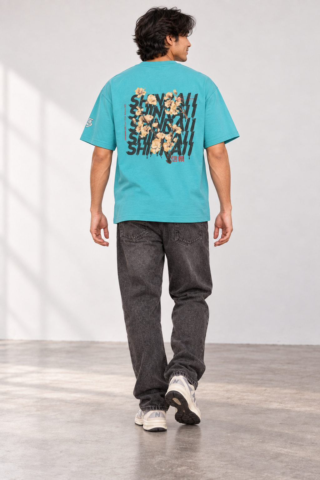 Aqua Shinraii Extreme Heavyweight T-Shirt, back view on model with charcoal jeans.