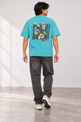 Aqua Shinraii Extreme Heavyweight T-Shirt, back view on model with charcoal jeans.