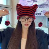Red Kawaii King knitted wool beanie with a cozy, kawaii style, featuring a soft, thick knit pattern and a cute, playful look.
